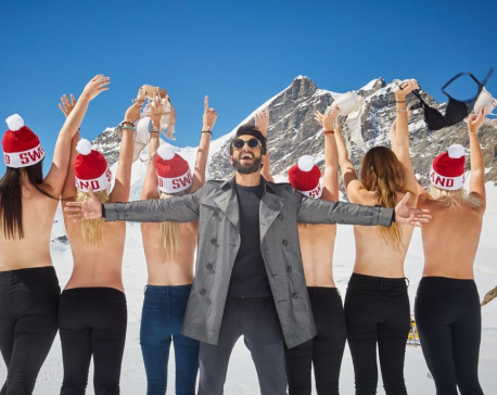 Ranveer Singh strikes a pose with topless girls